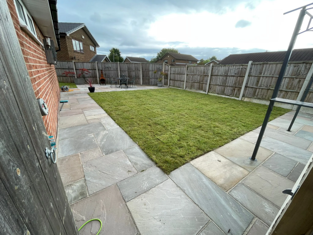 large-patio-sandstone-turfing large sandstone patio with new turfing